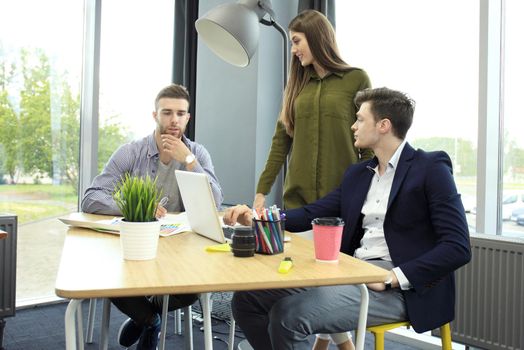 Group of young business people and designers. They working on new project. Startup concept.
