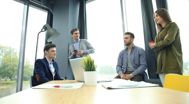 Group of young business people and designers. They working on new project. Startup concept.