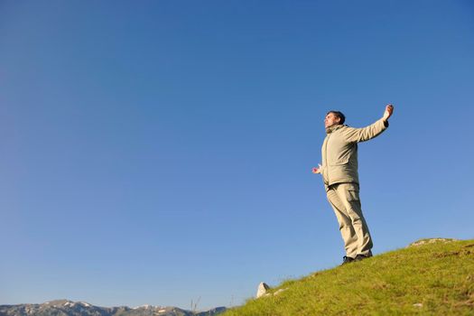 healthy young man practice youga in height mountain at early morning and sunrise