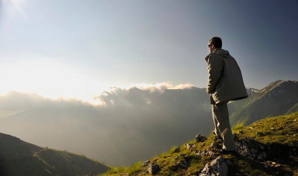 healthy young man practice youga in height mountain at early morning and sunrise