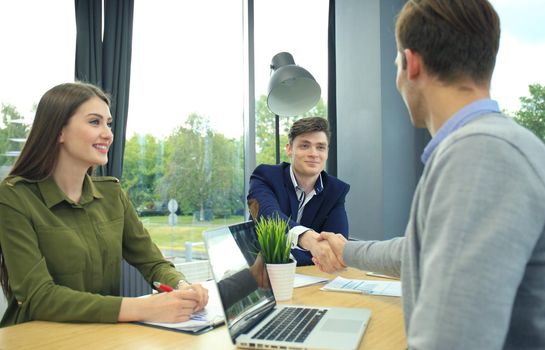 Job applicant having interview. Handshake while job interviewing.