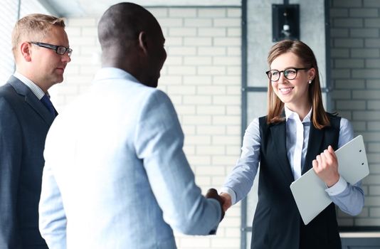 Business people shaking hands, finishing up a meeting