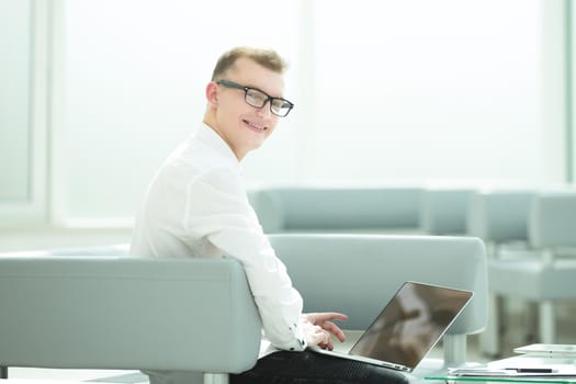 young businessman in the workplace in his office . people and technology