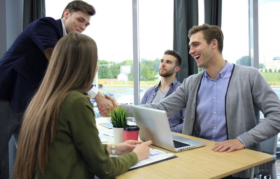 Job applicant having interview. Handshake while job interviewing.