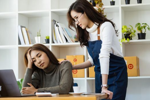 Sell products to online business owners. Two women are frustrated with online sales that aren't meeting their targets