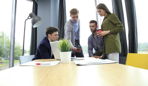 Group of young business people. They working on new project. Startup concept.