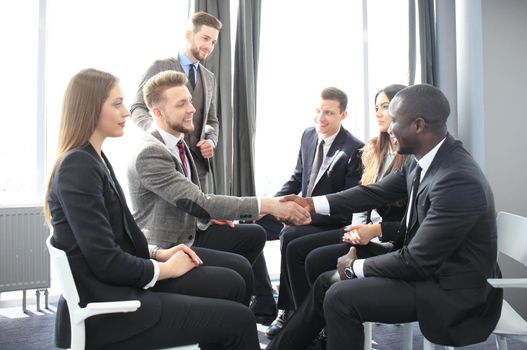 Business people shaking hands, finishing up a meeting