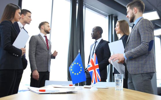 European Union and United Kingdom leaders shaking hands on a deal agreement. Brexit