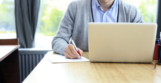 Businessman hands pointing at business document. Closeup.