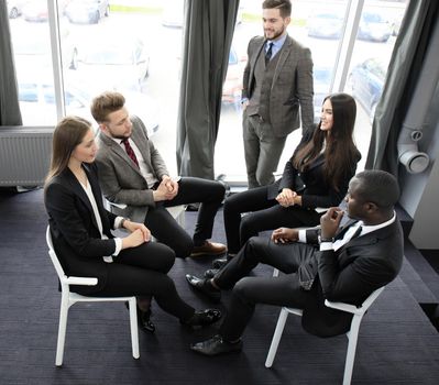 Business team discussing together business plans in office