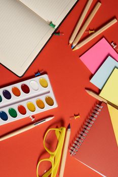 paint pencils drawing supplies design learning red background. High quality photo