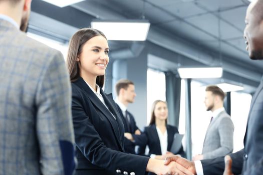 Business people shaking hands, finishing up a meeting
