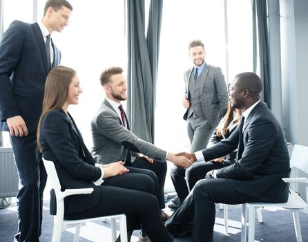 Business team discussing together business plans in office