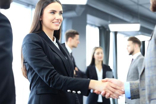 Business people shaking hands, finishing up a meeting