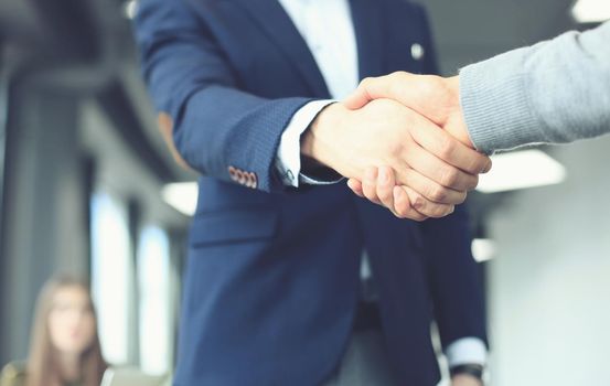 Business people shaking hands, finishing up a meeting