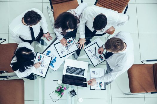 top view of business team discussing the company's financial plan for the modern workplace