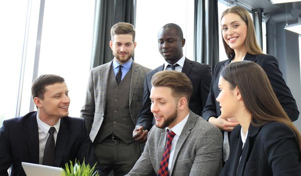 Business team discussing together business plans in office