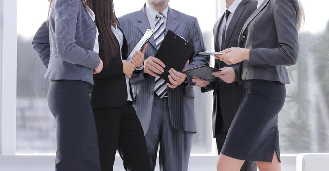 business team with documents standing in the modern office.photo copies of the space