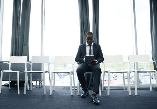Young man waiting for job interview indoors.