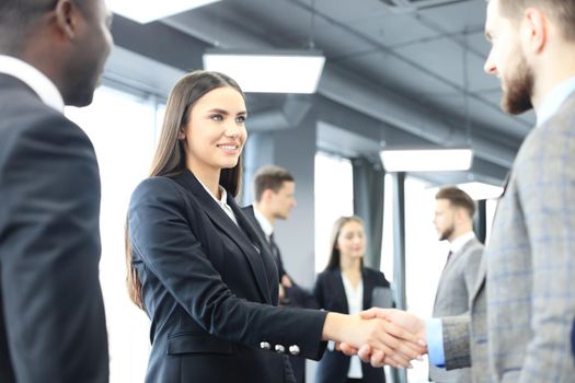 Business people shaking hands, finishing up a meeting