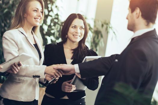 Conference of entrepreneurs. Deals with a handshake in the office