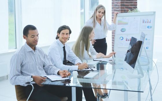 business woman conducts a presentation of a new project to business partners
