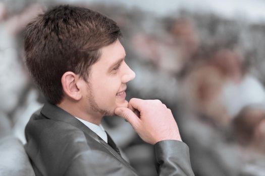 young entrepreneur sitting in the hall of the business center . business and education