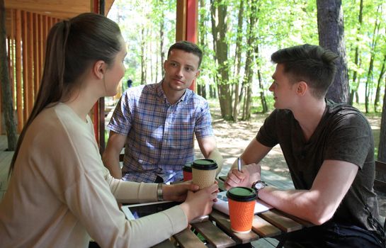 startup business, young creative people group brainstorming on meeting outside the office.