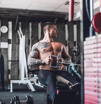 trainer showing back exercises in the gym. how to become stronger