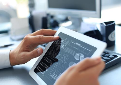 businessman working with digital tablet computer on wooden desk as concept