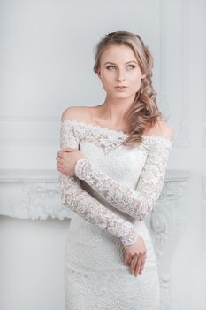 smiling happy bride trying on wedding dress . holidays and events