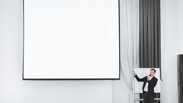 businessman with microphone during business presentation . business and education