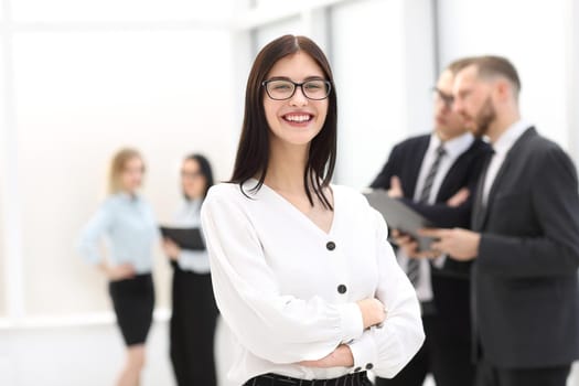 portrait of a happy businesswoman standing in the lobby office. photo with copy space