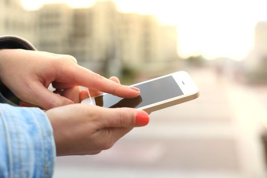 Close up of a woman using mobile smart phone