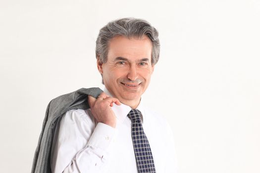 confident businessman holding a jacket over his shoulder .isolated on white background.