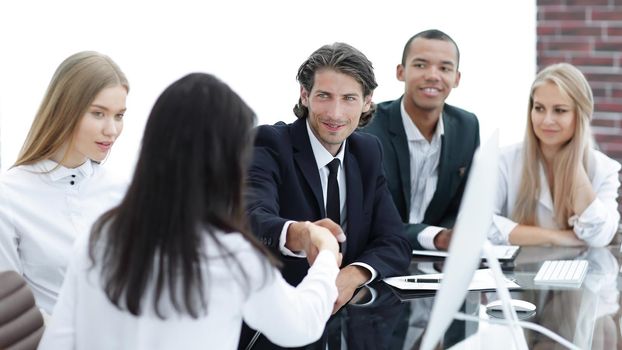 handshake business women with business partner at the negotiating table.the concept of partnership