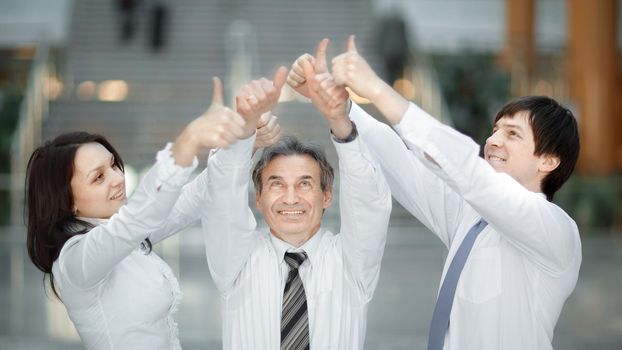 closeup .Group of young people hands with thumbs up together expressing positivity, teamwork concepts.