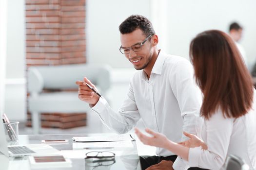 business people discuss something sitting at the office table . photo with copy space