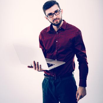 system administrator with a laptop against white background.the photo has a empty space for your text