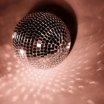 beautiful disco ball on yellow background isolated.photo with copy space