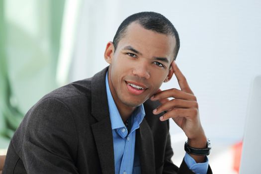 portrait of a handsome businessman on a workplace.photo with copy space