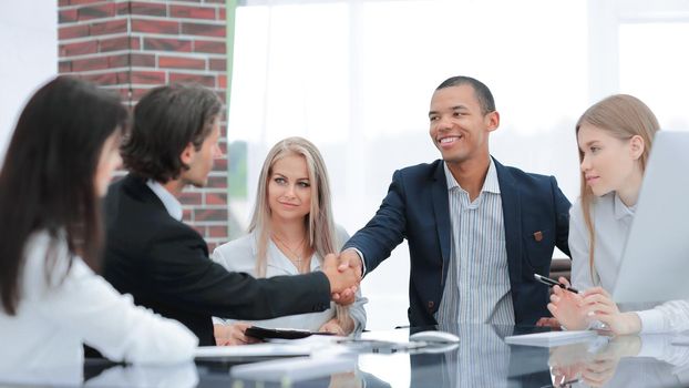 handshake Manager and customer in a modern office.photo with copy space