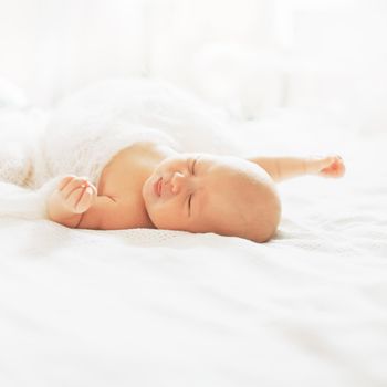 cute newborn baby is sleeping in the nursery. photo with copy space
