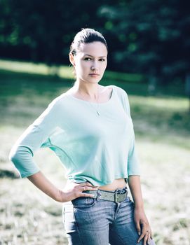 modern young woman on a walk in the Park. photo with copy space