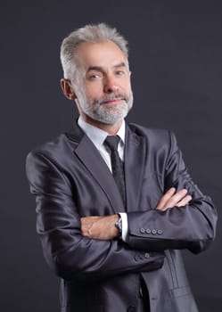 portrait of a senior businessman.isolated on dark background.