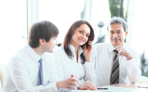 business colleagues analyzing financial statistics sitting at a Desk in the office.