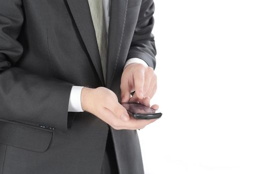 close up. businessman typing SMS on smartphone.people and technology
