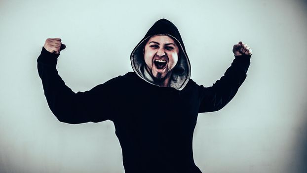 energetic guy rapper on a light background.the photo has a empty space for your text