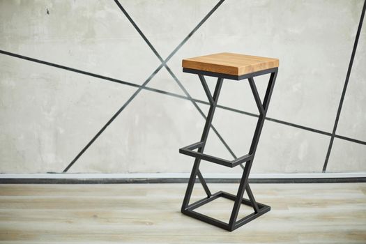 bar stool made of wood and metal. photo with copy space