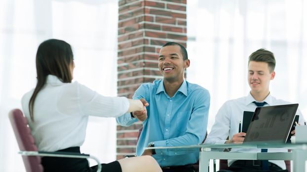 closeup.a handshake of a Manager and employee in the office.business concept